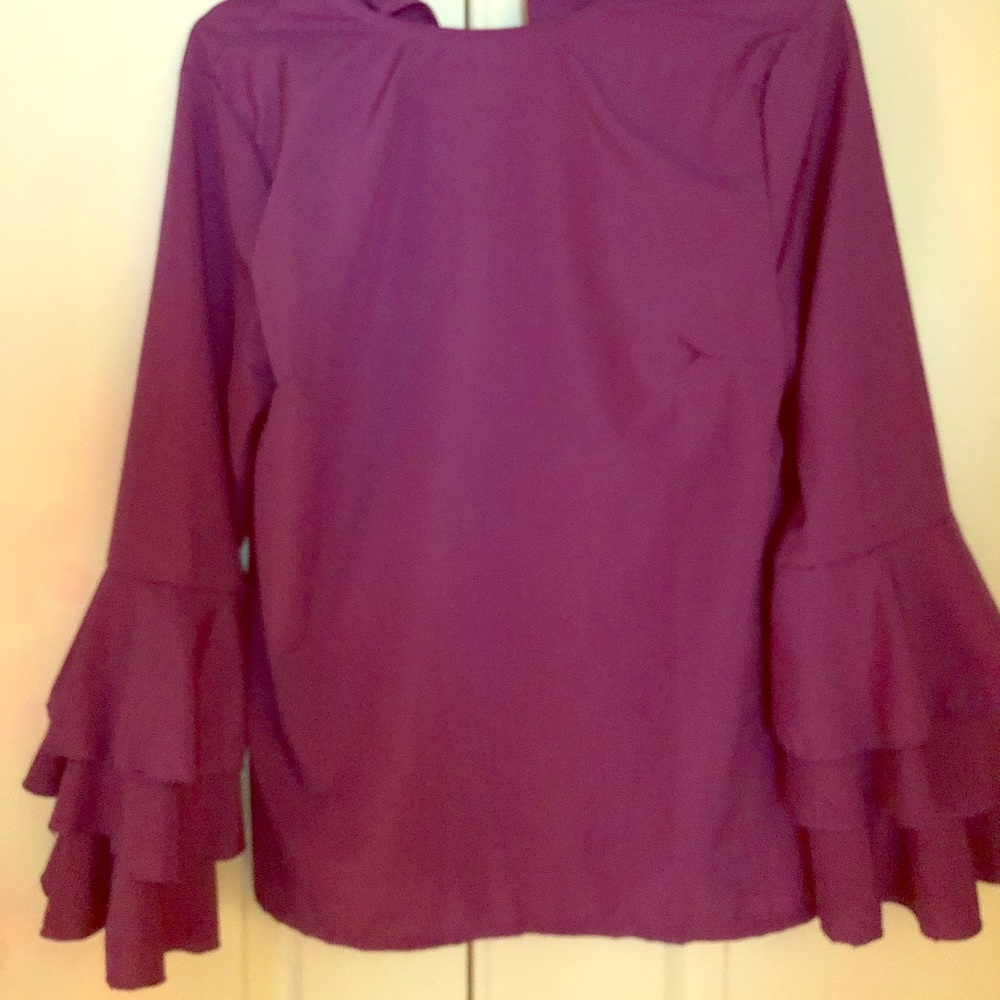 Beautiful top. The purple is very pretty :-)
